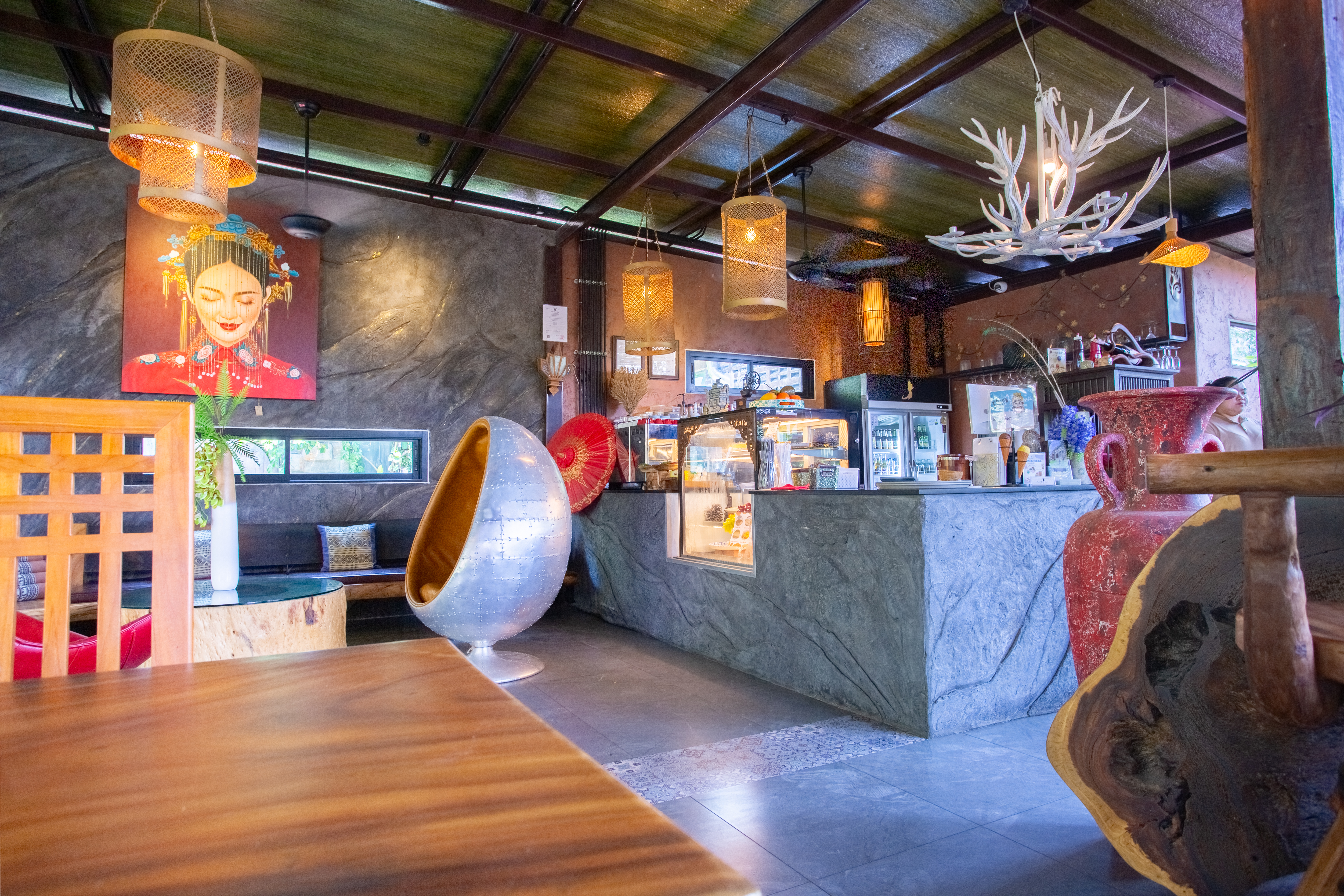 Decorative restaurant counter and seating at Apsara
