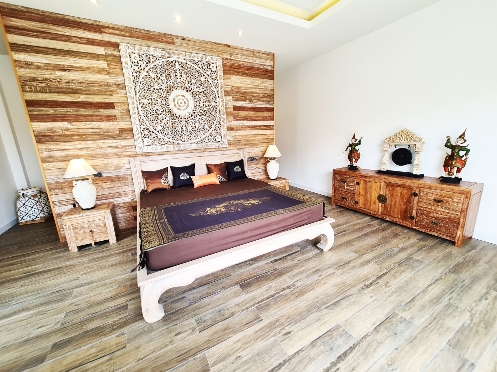 Bedroom with natural wood wall and carved decorative panel